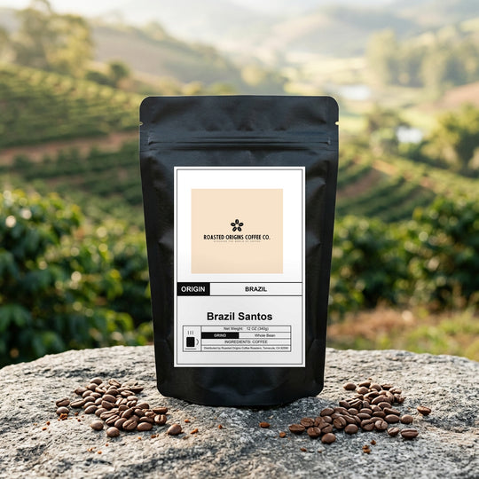 Brazil Santos coffee bag standing on pale granite outdoors, roasted beans scattered at its base