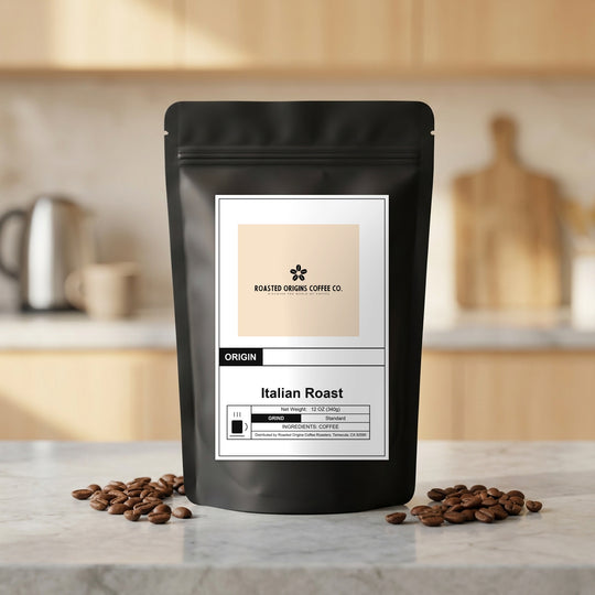 Italian Roast coffee bag standing on a marble kitchen counter, roasted beans scattered at its base